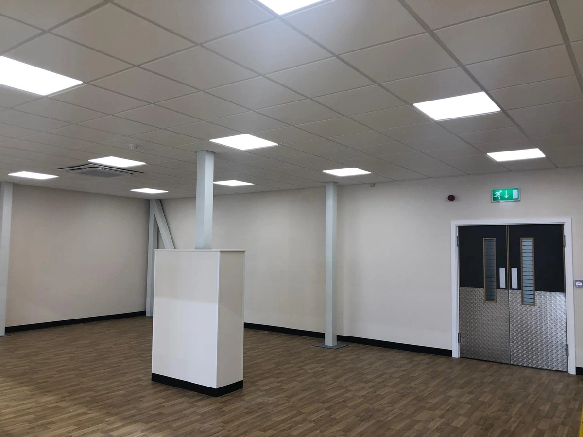 Recessed LED panel lighting in a suspended ceiling for a commercial interior