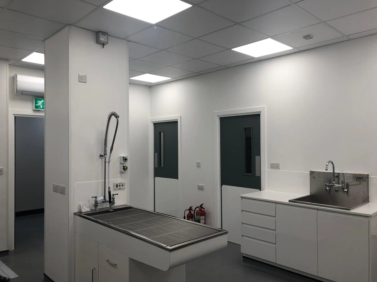LED panel lighting and electrical outlets installed in a commercial wash area
