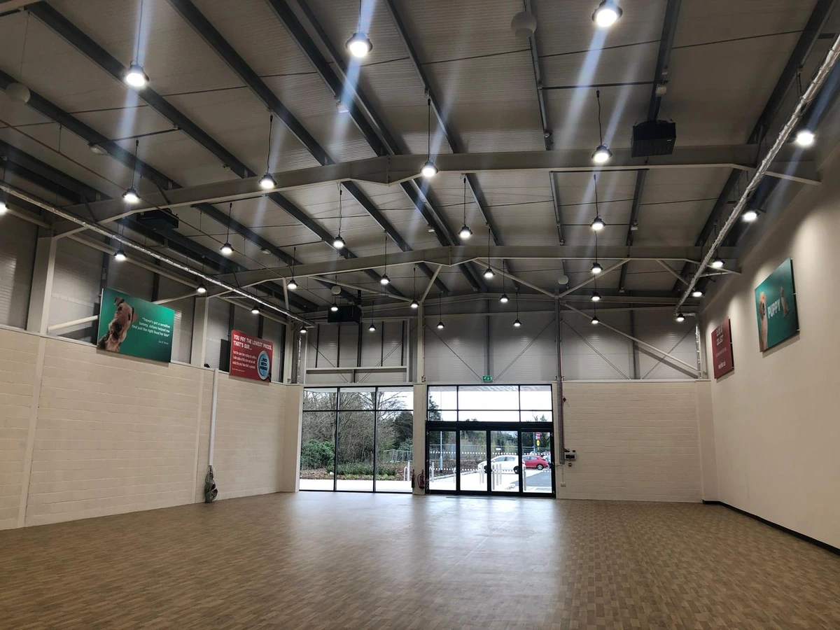 LED high-bay lighting installation across a large commercial hall