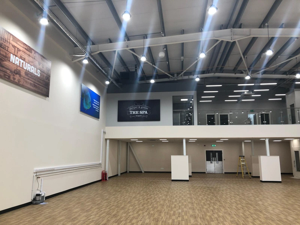 Commercial LED lighting installed throughout a mezzanine retail space